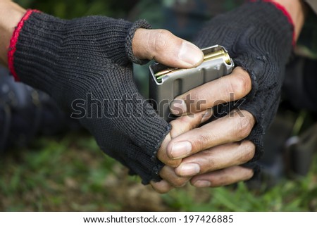 Ammunition on the soldier hands, Army