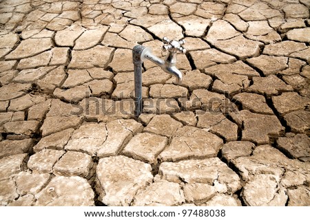 Water Faucet on Dry Soil Texture