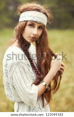 beautiful hippie girl in the country unbinding hair