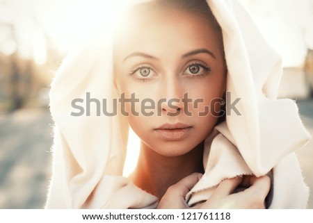 young woman in sari. outdoor portrait in soft sunlight