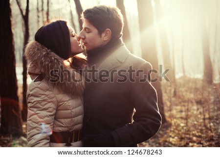 Couple Kissing On The Nature