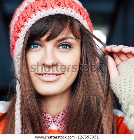 Outdoor closeup portrait of young girl in winter or cold spring