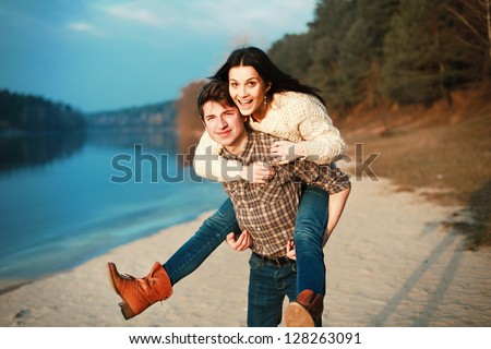 Young man and woman having fun outdoor in spring