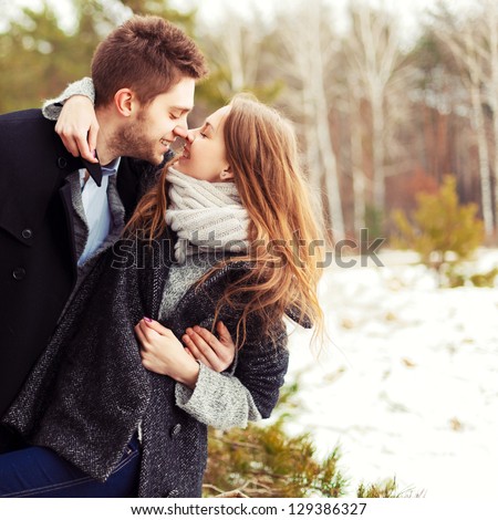 Portrait Of Happy Couple At Winter Resort