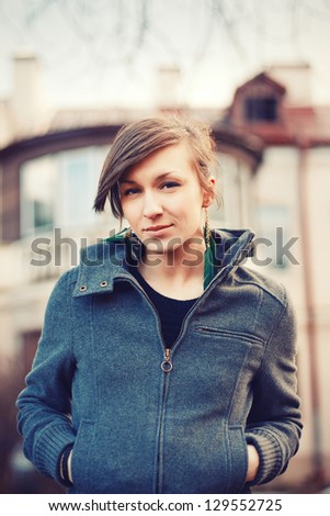 portrait of a beautiful brunette in the city in cold spring