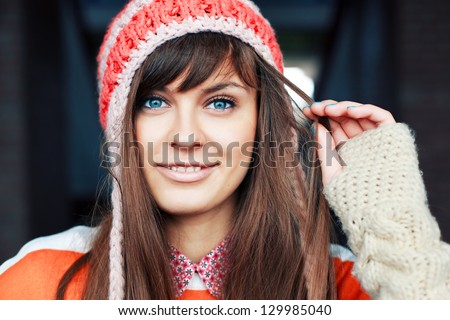 Portrait Of Young Pretty Funny Smiling Girl In Cold Weather Dressed In Color Clothes And Warm Hat. Young Happy Woman Having Fun Outdoor
