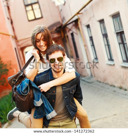 Young Beautiful Funny Couple In Love Having Fun Outdoor On The Street In Summer