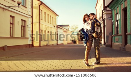 Landscape portrait of young beautiful stylish couple sensual and having fun outdoor in summer.