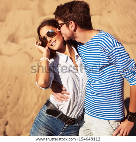 Young Handsome Man Kissing Pretty Brunette In Summer On Vacations. Happy Free Emotions.