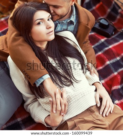 Fashion outdoor sensual portrait of young beautiful couple in love.