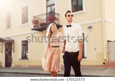 Beautiful Young Fashion Stylish Couple Walking On The Street In City Old Town Together In Summer Evening Ready To Night Party And Have Fun With Love