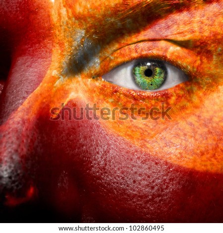 Sun and sun flare painted on a face to show medical conditions concept such as sensitive skin or inflammation. Can als be used to portray a hothead or angry person.