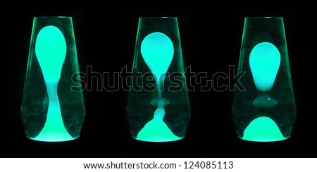 Three lava lamps showing progress of the Aqua wax going up and separating