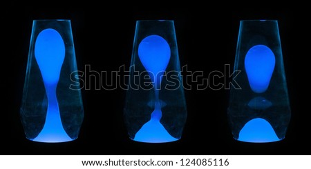 Three lava lamps showing progress of the Blue wax going up and separating
