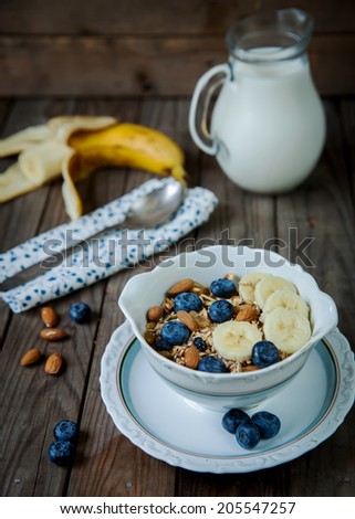 Muesli with berries and milk. Breakfast.