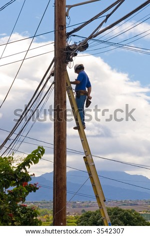 Telephone Repair man installing to cable services to costumers