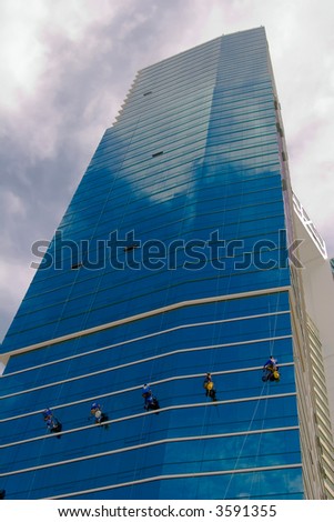 Window washers cleaning the exterior of a residential building