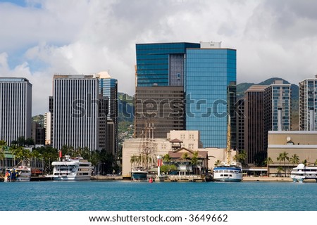 Downtown Honolulu Skyline with boats and skyscrapers fronting Honolulu Harbor