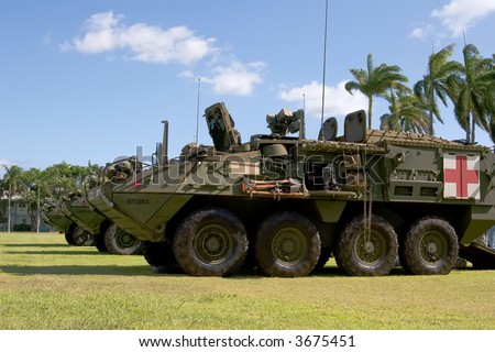 Camouflage Army Strykers with the Medic configuration in front