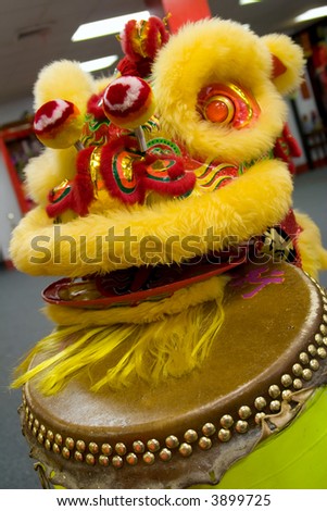 Chinese lion head sitting on top of the drum