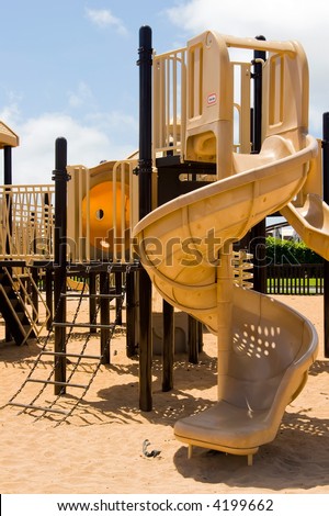 Children's playground equipment featuring a tower slide and chain ladder