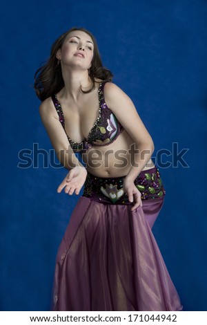 Oriental dance model on a blue background