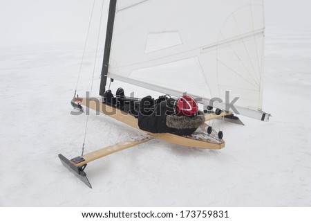 Race of sailing boats on the sea ice in winter