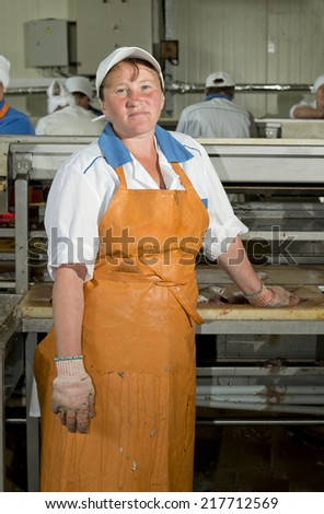 The woman was treated fish at the fish factory. Primorye, the settlement of the Transfiguration,  Russia