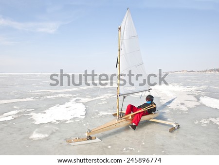 Race of sailing boats on the sea ice in winter