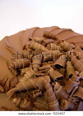 chocolate mousse cake with spiral chocolate shavings on top closeup