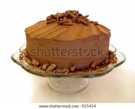 chocolate mousse cake with spiral chocolate shavings on top viewed from side