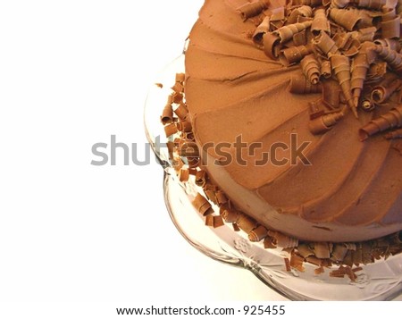 chocolate mousse cake with spiral chocolate shavings on top viewed from above