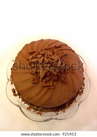 chocolate mousse cake with spiral chocolate shavings on top viewed from above
