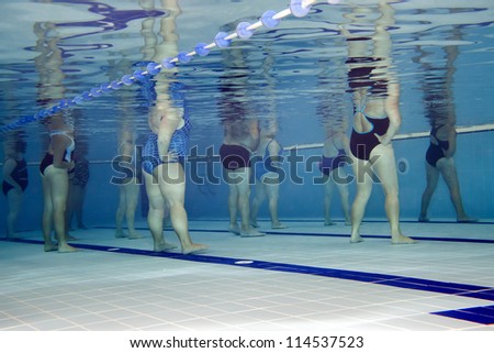 Underwater picture of an aerobics class.