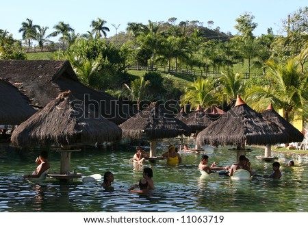 People on a tropical resort´s hot pool on a sunny summer afternoon (Pousada do Rio Quente/Brasil)