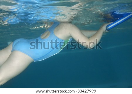 Underwater picture of a young girl at a swimming class.