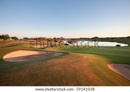 Landscape of a golf course at dusk.