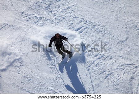 Skier (mature man on 40s) seen from above