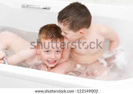 brothers playing in the bath tub