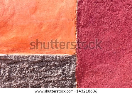 Old adobe wall abstract background. Textured fragment of painted wall. Architecture background.