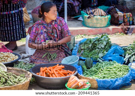 SOLOLA, GUATEMALA- MAY 10: An unidentified woman sells vegetables at traditional weekly market in Solola), Guatemala on 10 May 2013.