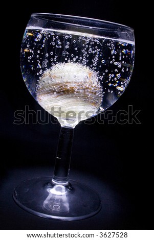 The footed tumbler with onyx sphere in it and there are lot of bubbles around