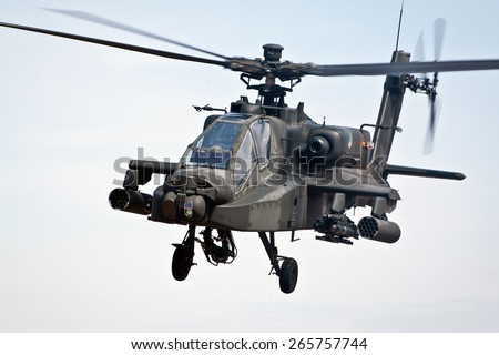 EINDHOVEN, THE NETHERLANDS--11 JUNE 2014-- A Apache helicopter from the Royal Dutch Airforce is flying through the sky.