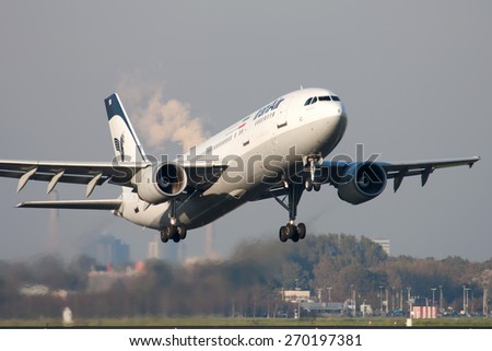 AMSTERDAM, THE NETHERLANDS--17 JUNE 2014-- A Iran air Aurbus has just lifted off the runway.
