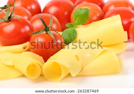 Slices of cheese on white background, tomato, Basil