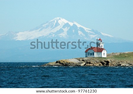 The Patos Island Lighthouse in front of Mt. Baker in Washington's San Juan Islands.
