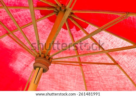 Red umbrella for sun and rain