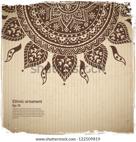 Ethnic sun ornament on the Cardboard background Ethnic sun ornament on the Cardboard background