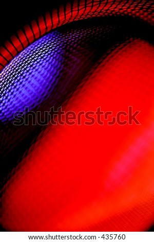 Abstract macro of window screen and glass vase.