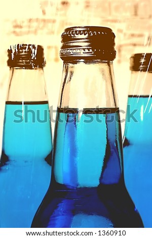 Three blue soda bottles.